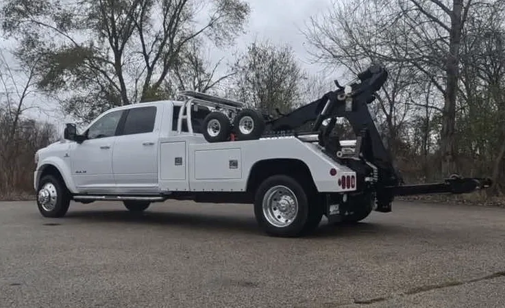 Orleans wrecker equipment securing damaged vehicle